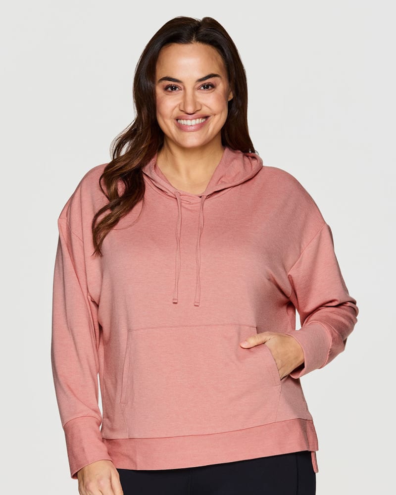 Front of a model wearing a size 1X Juniper French Terry Hoodie in Pink by RBX Active. | dia_product_style_image_id:244700